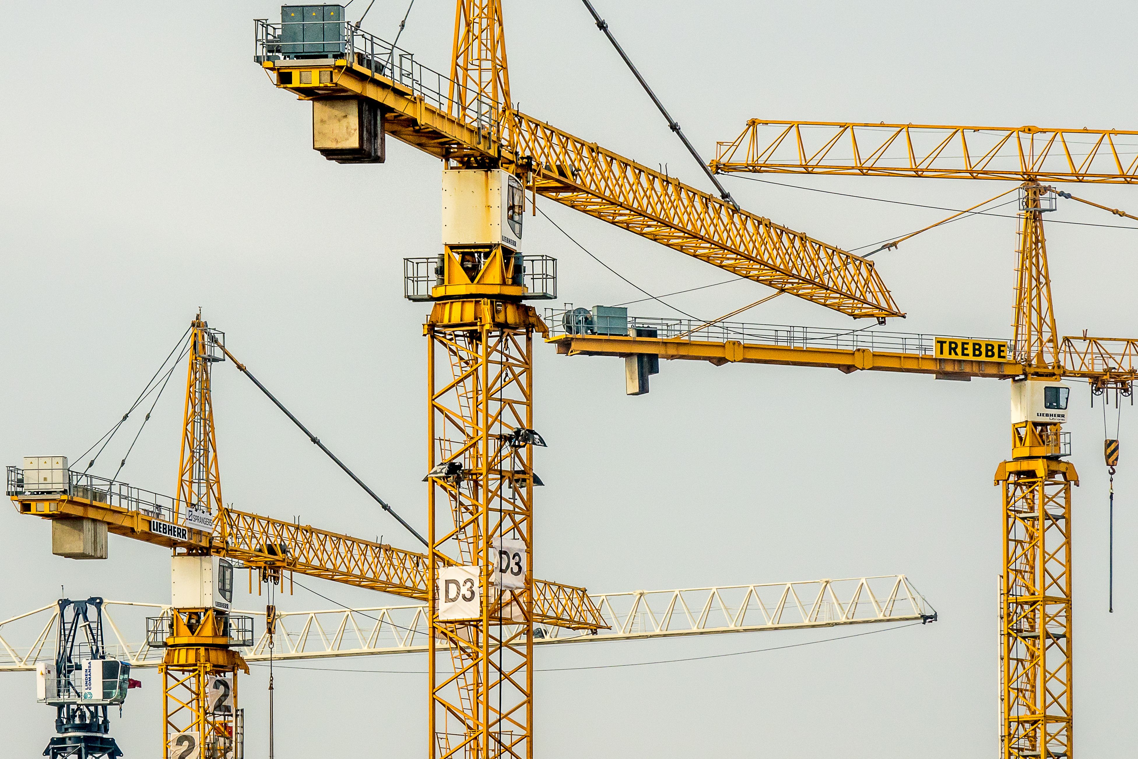 Tower cranes on an active high-rise construction site.
