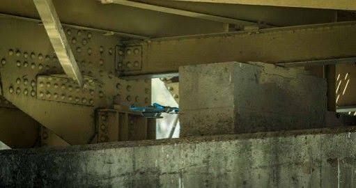 Drone inspecting the underside of a steel bridge.